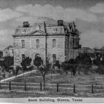 A promotional postcard image of the old Blanco County Courthouse used as a bank